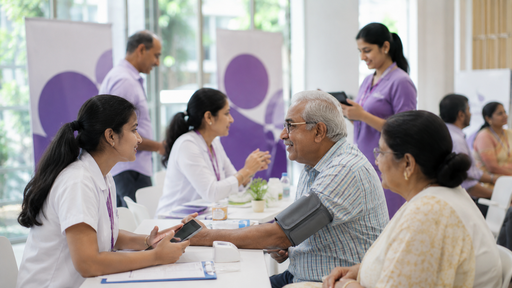 Healthcare professionals supporting people at a community health campaign in India